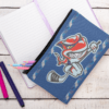 pouch mockup featuring a journal and a white wooden table 29985
